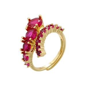 Adjustable hip hop ring in gold finish with vibrant red colored gemstones in claw setting