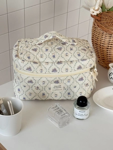 Quilted makeup bag with cute rabbit pattern and top handle for organized storage