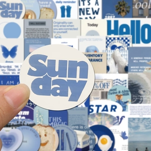 Close-up of blue 'Sun day' round aesthetic sticker for DIY scrapbooks and phone cases
