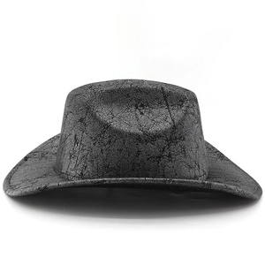 Detail of vintage western cowboy hat featuring dark grey distressed cracked leather texture