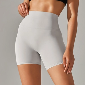 Close-up of high-waisted seamless yoga shorts with wide tummy control waistband in grey
