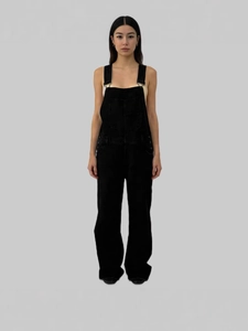 Women's casual loose denim black overalls with pockets shown on a professional model