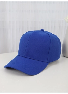 Detail of blue cotton twill fabric and stitching on a classic solid baseball cap