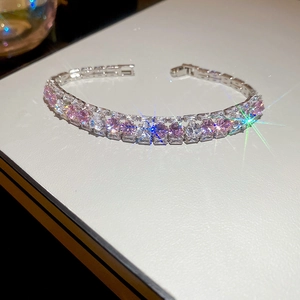 Detail of luxury double-row tennis bracelet with pink and white cubic zirconia stones
