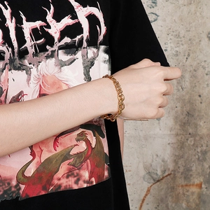 Golden stainless steel link chain bracelet for men and women on wrist