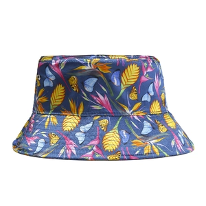 Detailed close-up of dark blue bucket hat with vibrant tropical floral and butterfly print