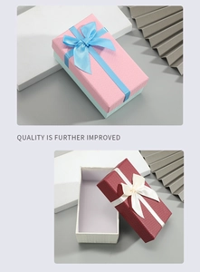 Detail of rectangular gift boxes with ribbon bows and fine cardboard texture