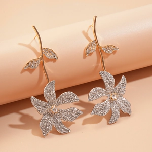 Elegant asymmetrical floral stud earrings with sparkling rhinestones and gold-tone finish