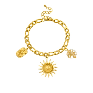 Detail of gold Figaro chain bracelet with sun, rectangle tag, and flower charms