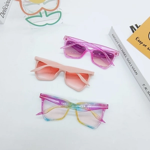 Detailed flat lay of irregular cat eye sunglasses in pink and rainbow gradient colors
