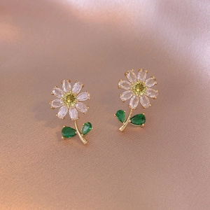 Exquisite copper daisy stud earrings with zircon petals and gold stem on rose silk background
