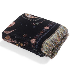Bohemian knit picnic blanket with moon and star patterns and colorful tassels