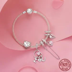 Pink heart 925 sterling silver charm bracelet with Family Forever clasp on pink background