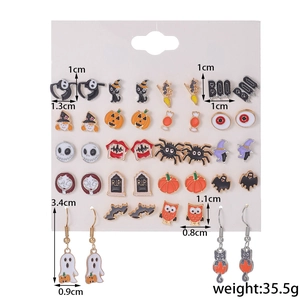 Detailed view of Halloween earring set featuring pumpkin ghost and spider designs