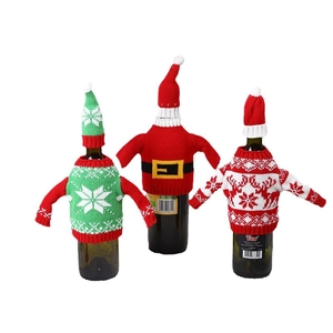 Three-piece set of knitted Christmas wine bottle covers with snowflakes and reindeer motifs