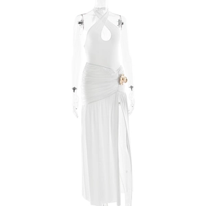 Detail of white halter neck dress with high side slit and decorative gold waist buckle