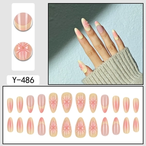 Pink and yellow gradient press-on nails with 3D floral accents and 24-piece set
