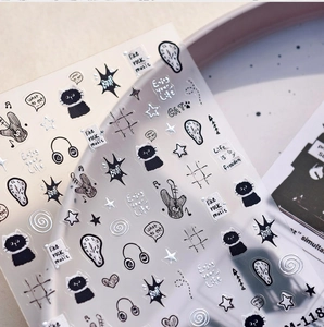 Macro detail of M-118 cartoon nail art stickers with black cat and music motifs
