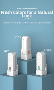 Three smart mist aroma diffusers in grey, pink, and green on a 3D geometric display