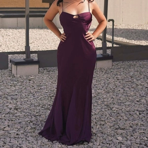 Slim fit plum purple satin slip maxi dress with mermaid silhouette and cutout detail