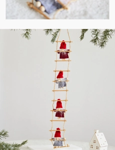 Detail of wooden rope ladder with four Santa Claus dolls for Christmas tree decoration