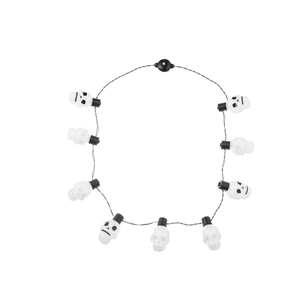Halloween skull light string necklace with white translucent skull bulbs on a black wire