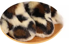 Close-up of leopard print plush fabric showing the soft texture and detailed spots