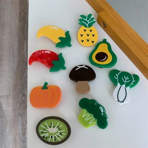 9-piece set of cartoon vegetable and fruit acetate hair clips on white background