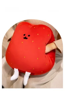 Plush strawberry hand warmer pillow in bright red soft fabric with cartoon features