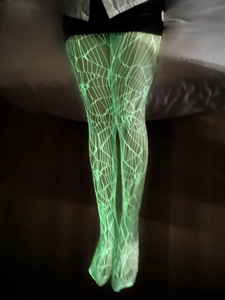 Bas résille vert fluo avec motif de toile d'araignée lumineuse pour les fêtes d'Halloween