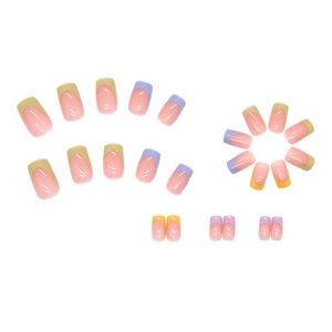 French tip press on nails in nude pink with pastel yellow and purple accents