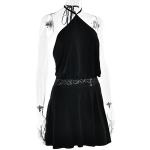 Detail view of black halter mini dress featuring intricate lace patchwork on the waistline