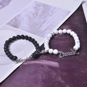 Magnetic white turquoise and lava stone couple bracelets with custom engraved name tags