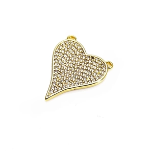 Macro view of gold heart pendant featuring pave-set micro cubic zirconia with double rings