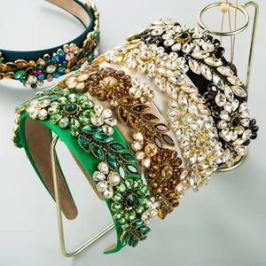 Detail of luxury padded headband with multi-color rhinestones and metal pendants