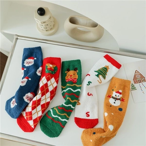 Christmas coral fleece thermal socks featuring festive patterns on a minimalist white background