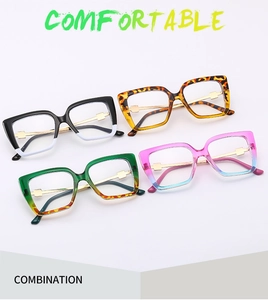 Flat lay of cat-eye glasses frames in multiple colors with metal temples and diamond accents