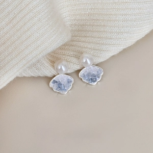 Elegant silver shell stud earrings with white pearl and light blue crystal stone