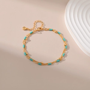 Double-layered 18K gold plated turquoise beaded bracelet with elegant lobster clasp