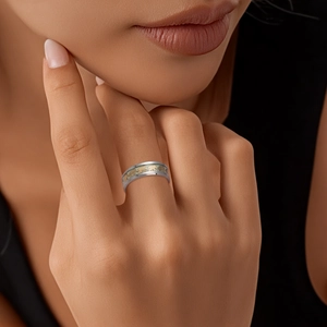 Luminous elephant pattern ring in silver and gold metal finish worn by a model