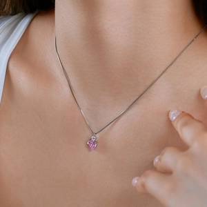 Elegant S925 sterling silver necklace with pink heart zircon pendant worn by a model