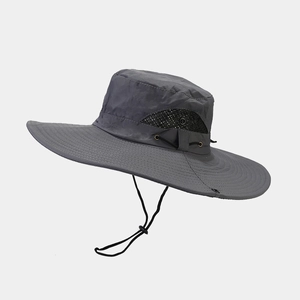 Close-up of dark grey outdoor hat with wide brim and breathable black mesh vents