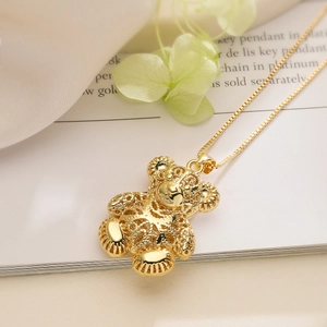 Exquisite gold-plated bear pendant necklace with intricate hollow carving and zircon stones
