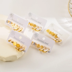 Golden stainless steel earring set featuring crown, butterfly and zircon stud designs