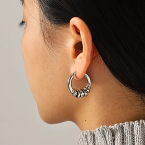 Minimalist silver stainless steel hoop earrings with small decorative rings for women