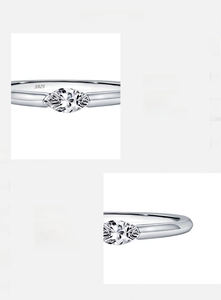 Detailed view of s925 silver irregular ring with foil texture and marquise zircon