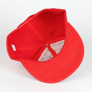 Detail showing inner cotton sweatband and care label inside a red hip hop baseball cap