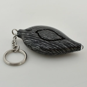 Leaf-shaped personal safety alarm with wood grain pattern and metal keychain clip
