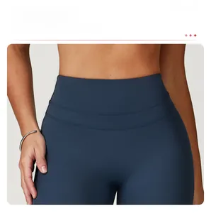 Detail of high-waisted yoga leggings showing tummy control and anti-roll waistband