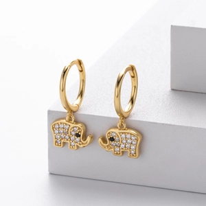 Detailed macro shot of S925 sterling silver elephant drop earrings with pavé set zircons